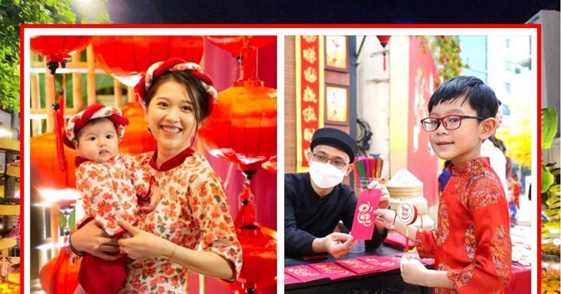 Mẹ địu bé dạo chơi quanh khu vực chợ Bà Chiểu, Sài Gòn, gần Mi Hồng Bà Chiểu.